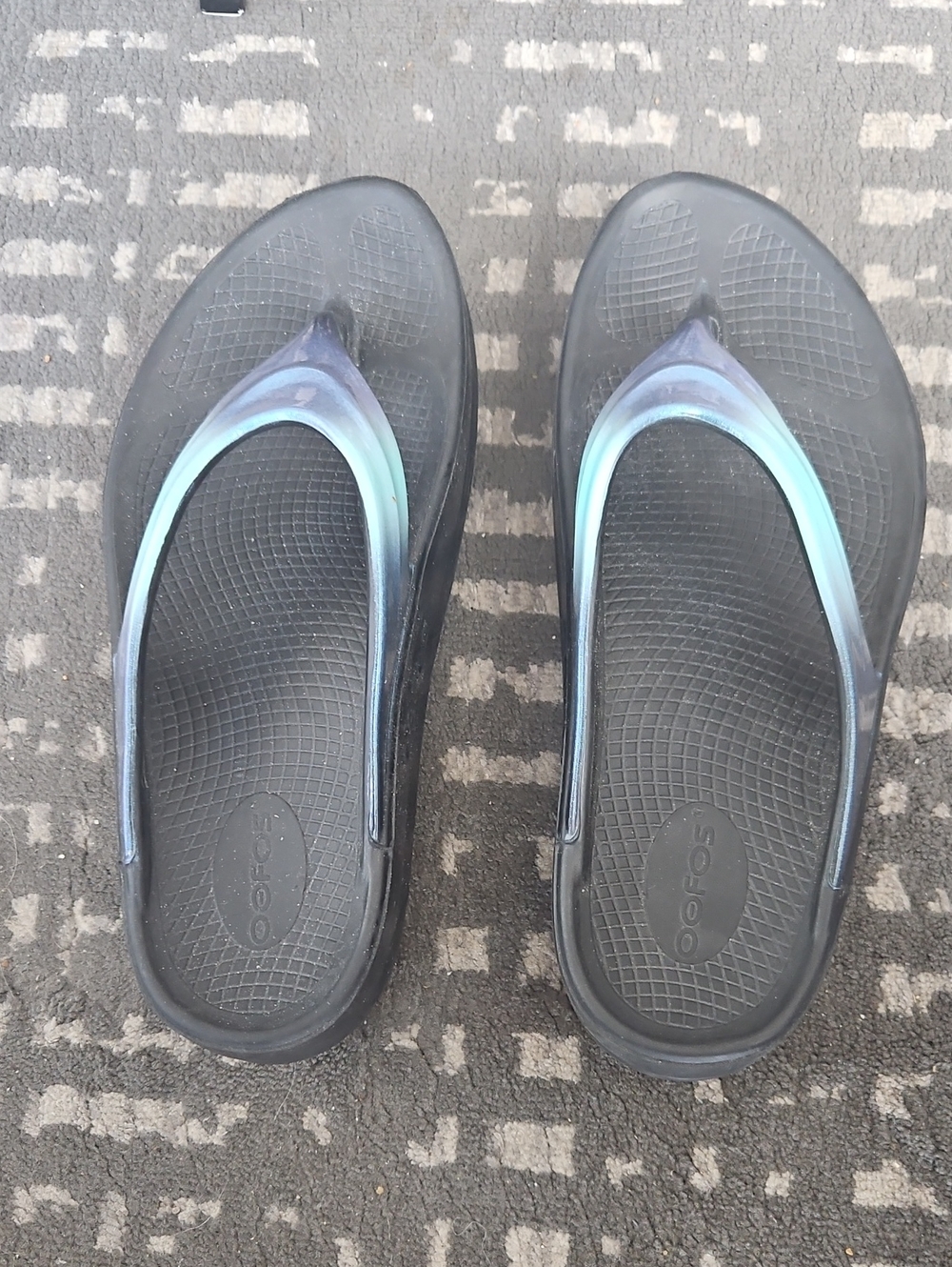 Oofos Women’s Black Sandals with Iridescent Blue-Green Straps